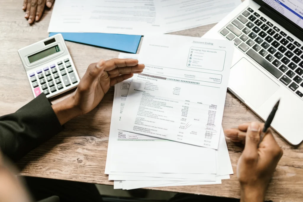 Person organising tax documents, deduction receipts, and income statements for Australian tax return