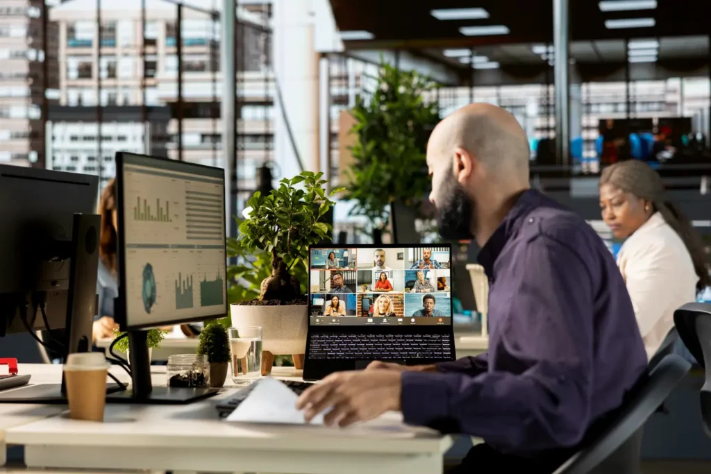 Team of outsourced accountants working remotely on Australian accounting software and interacting with client on video conference