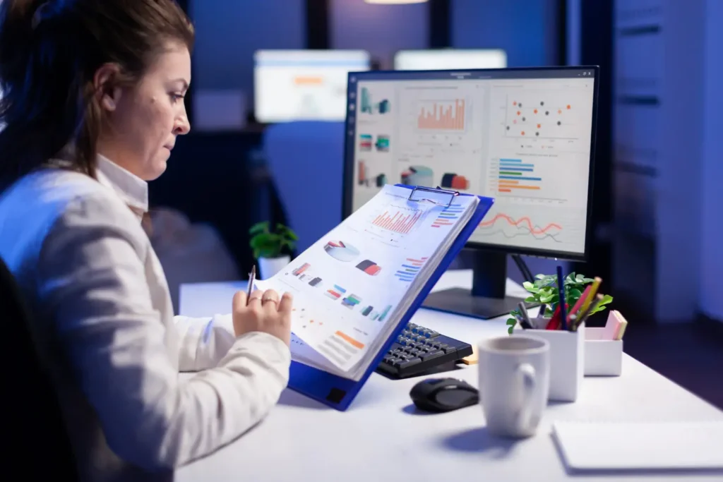 Australian accountant reviewing financial statements and tax records before finalising accounts