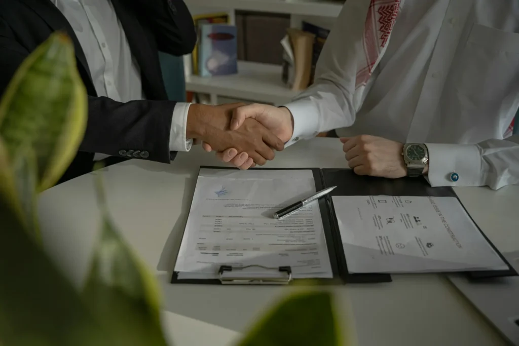 Accounting firm partner agreeing an outsourcing arrangement after a successful trial