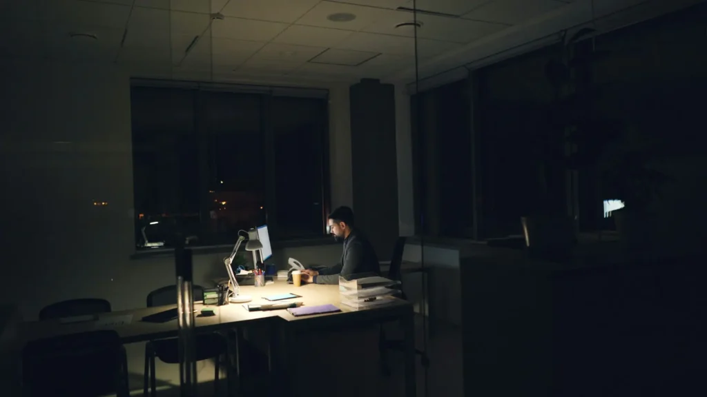 Australian accounting firm partner working through a backlog of client files after hours
